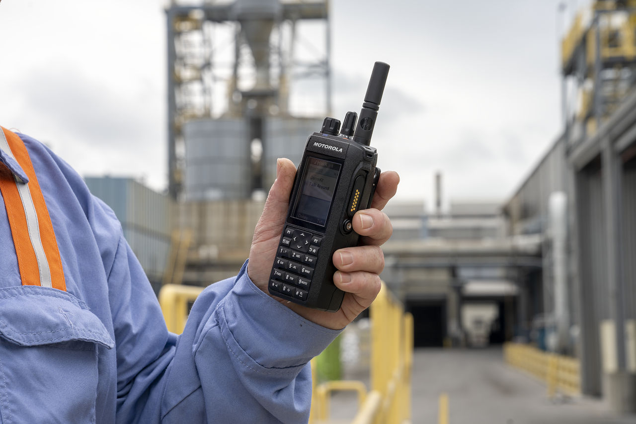 long-living two way radio being held on a construction site