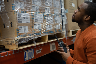 Man with Motorola radio in a warehouse