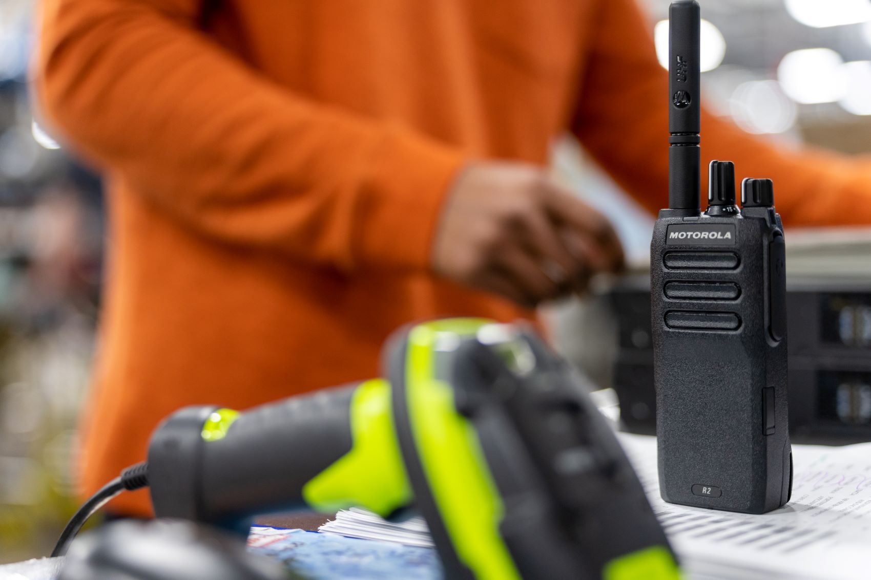 man repairing Motorola radio